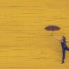 woman holding brown umbrella